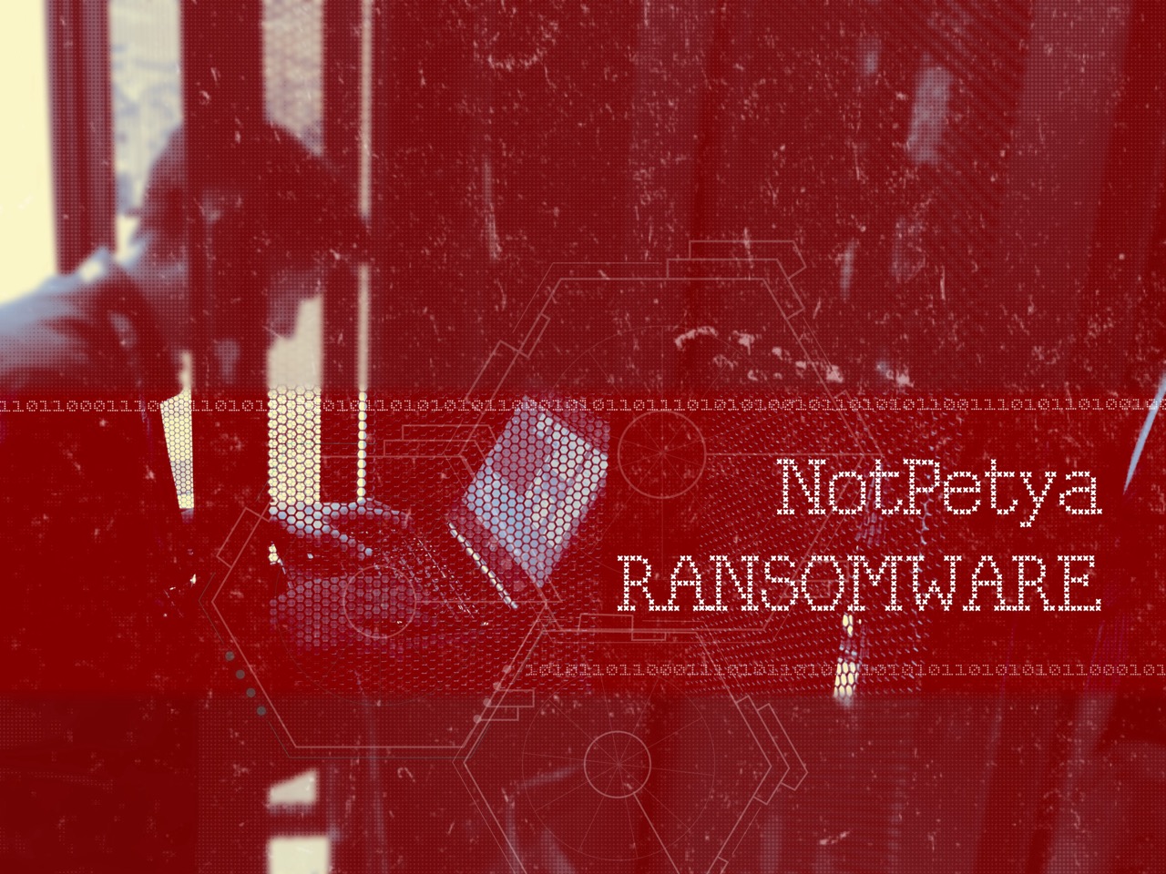 Man sits using laptop computer, image overlaid with digital hexagons, binary code strings, and caption “NotPetya RANSOMWARE.” 