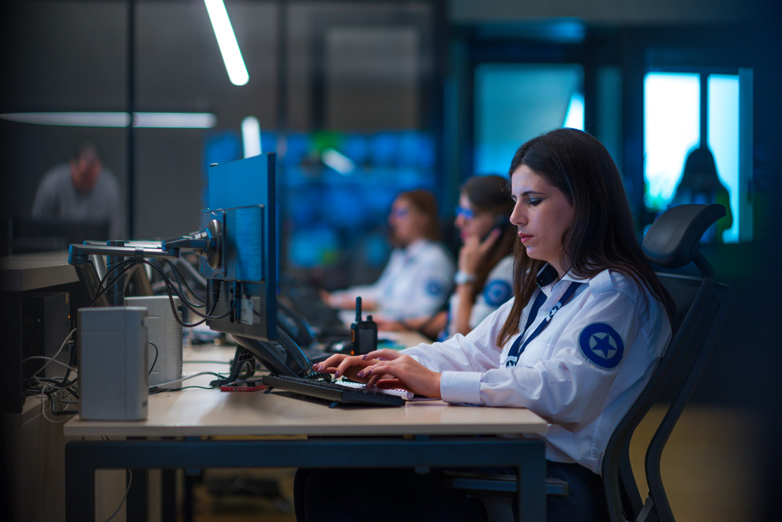 Woman cyber security specialist in front of her computer. 
