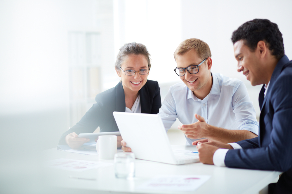Company executives are elated after reviewing via laptop the coverage included in their organization’s Cyber Insurance policy.