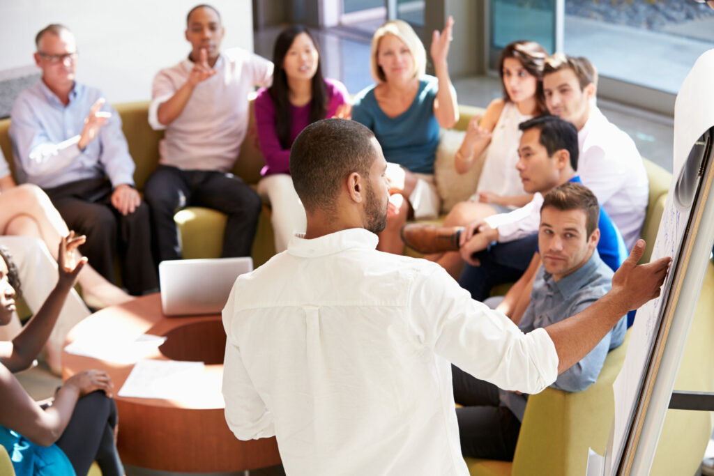 Company employees hold meeting discussing plans to improve data security.