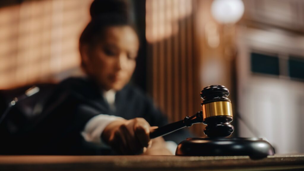 Court of appeals judge strikes her gavel as she delivers a ruling in a lawsuit for a data breach.