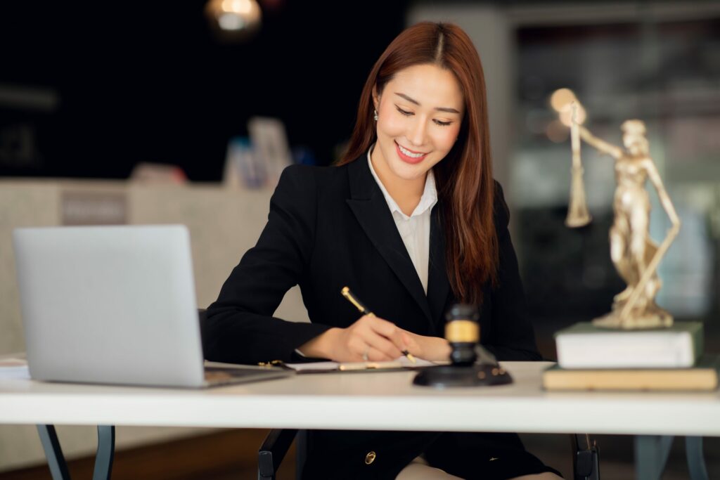 Smiling lawyer preparing to give a consultation covered by Cyber Liability Insurance.