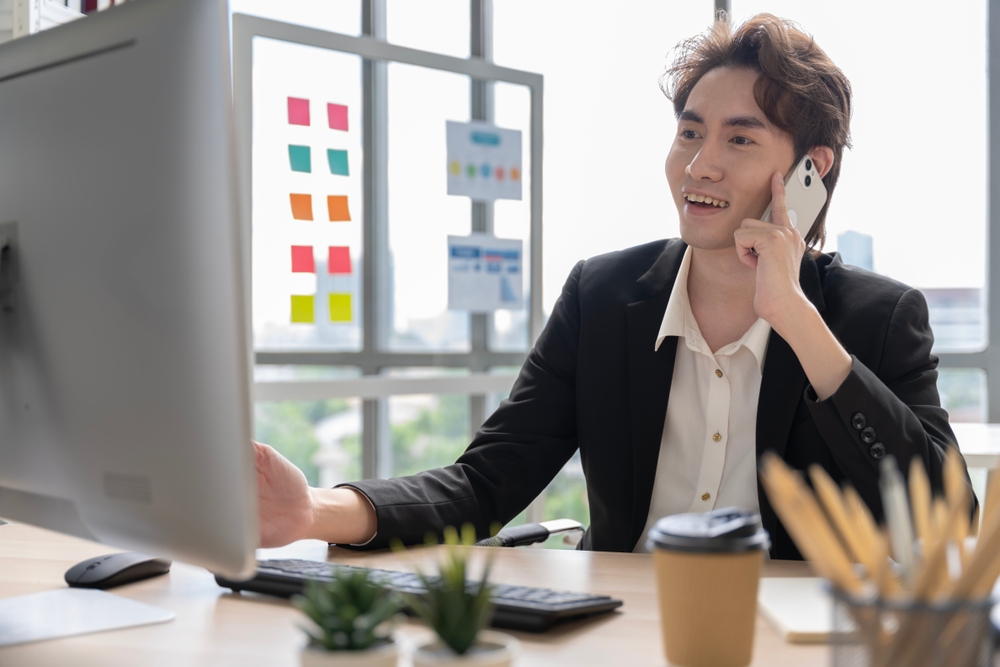  Happy Cyber Insurance agent contacts client after finding the ideal policy.
