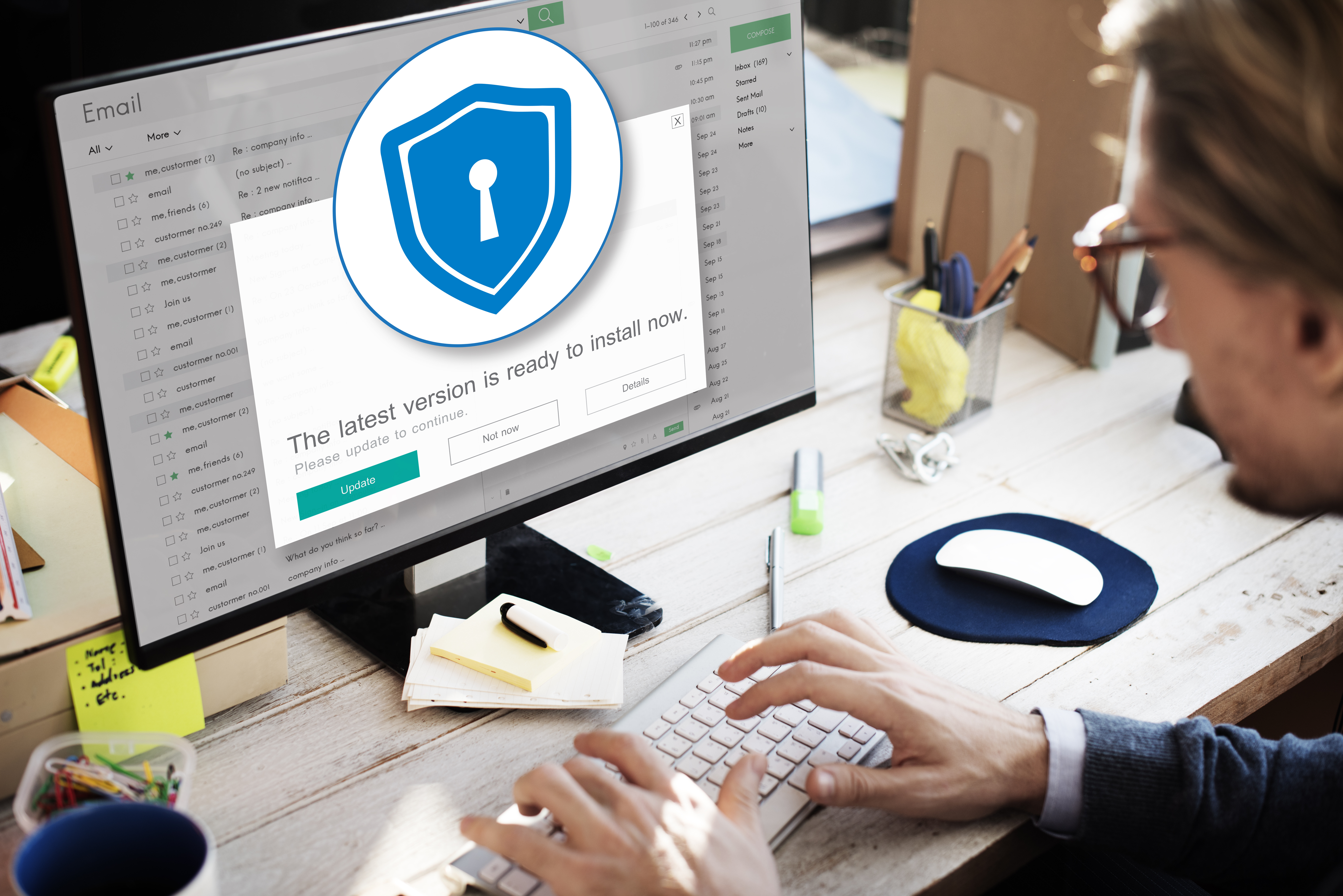 Employee updates desktop as a new safety measure against data breaches.