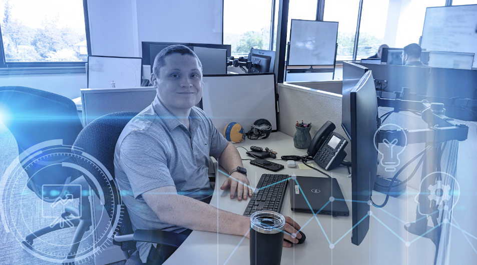 A smiling ProWriters agent is busy working at his desk.